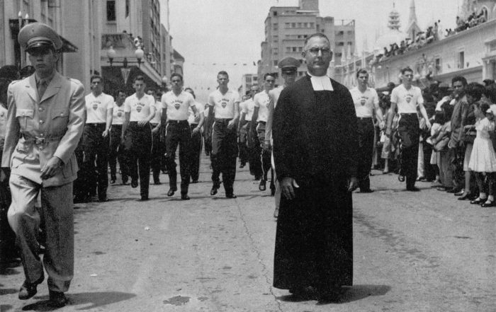 Brother Director leads a parade of students from Colegio La Salle through the streets of Caracas, Venezuela. Founded in 1922, La Salle College remains one of the most renowned Lasallian Institutions in Venezuela.