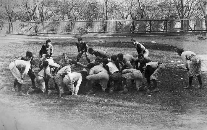 Students of Manhattan College enjoy a pick-up game of football on the grounds of its original campus located in Manhattan, at 131st Street and Broadway in 1900.